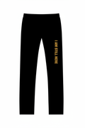Black sweatpants with gold I Am Still Here text on leg